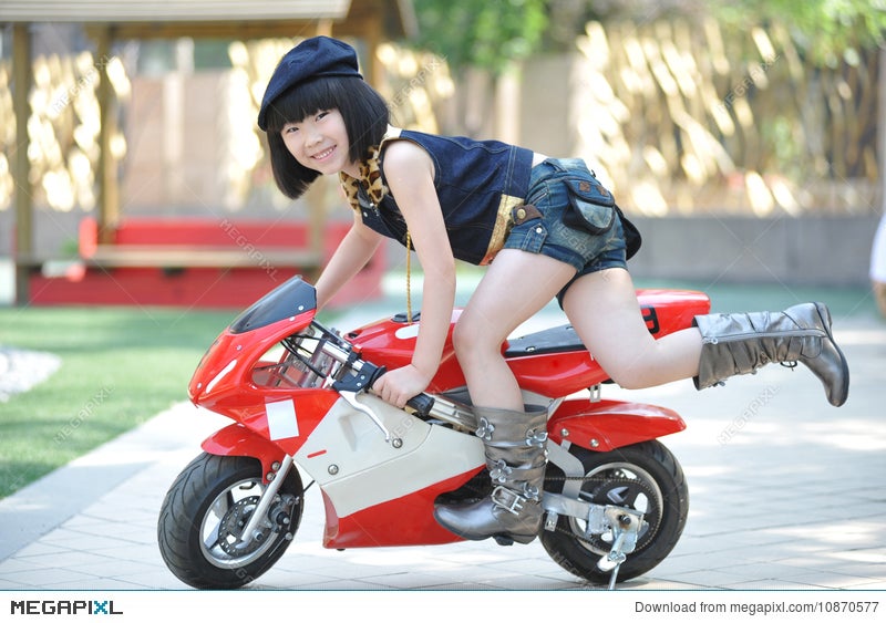 little girl riding motorcycle