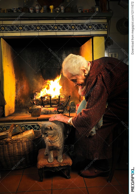 elderly people sitting by fireplace