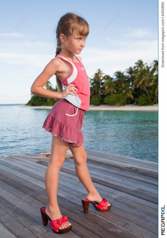 Girl Posing In Mom's Red Heels Stock 