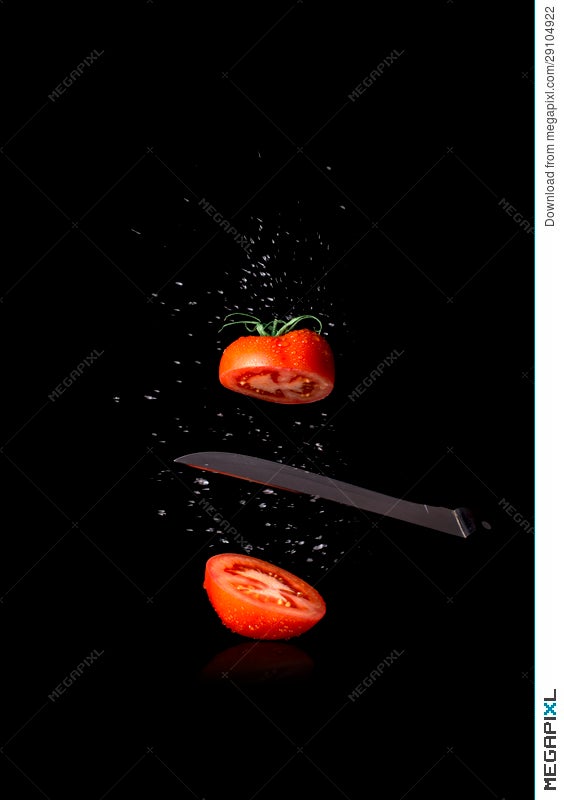 Best Red Tomato Cut In Half On Black Background Stock Photo 29104922 -  Megapixl