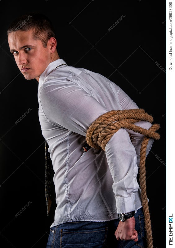 Teen guy tied down