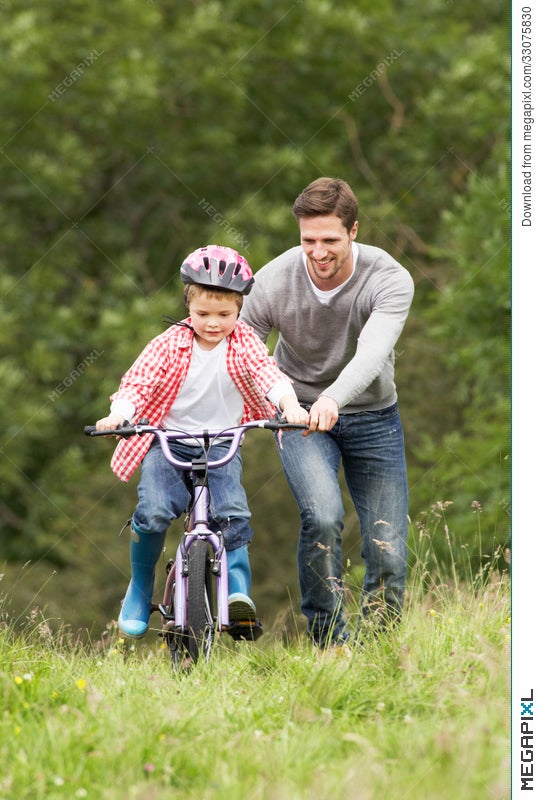 teaching son to ride bike