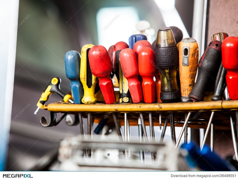 Assortment Of Tools Hanging On Wall Screwdrivers In Mechanic