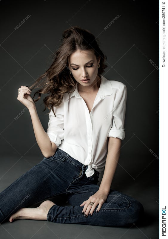 Woman In White Blouse And Blue Jeans Stock Photo Megapixl