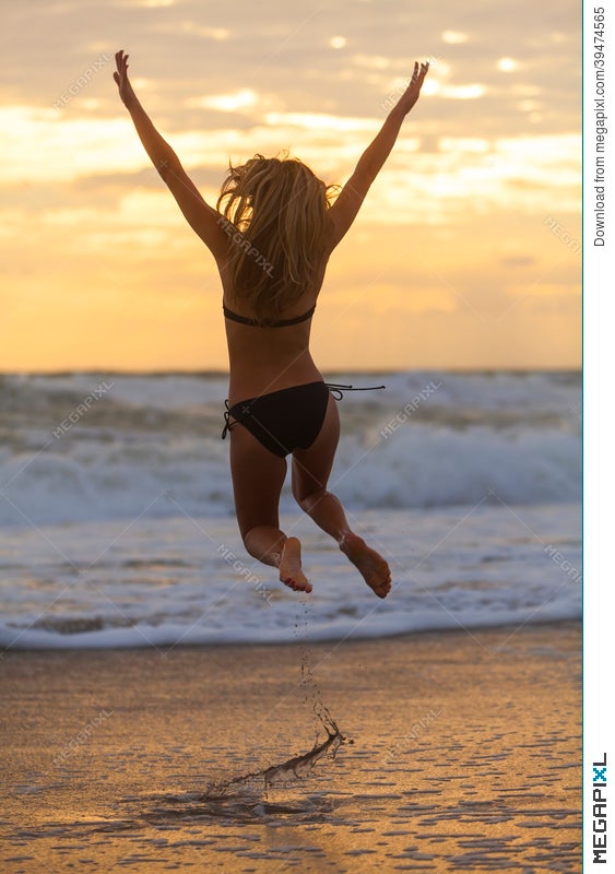 Bikini Woman Girl Jumping Sunset Sunrise Beach Stock Photo