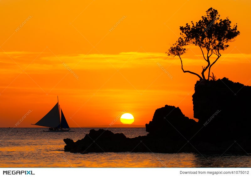 Sailboat At Beautiful Sunset Above The Tropical Sea Silhouette Stock Photo Megapixl