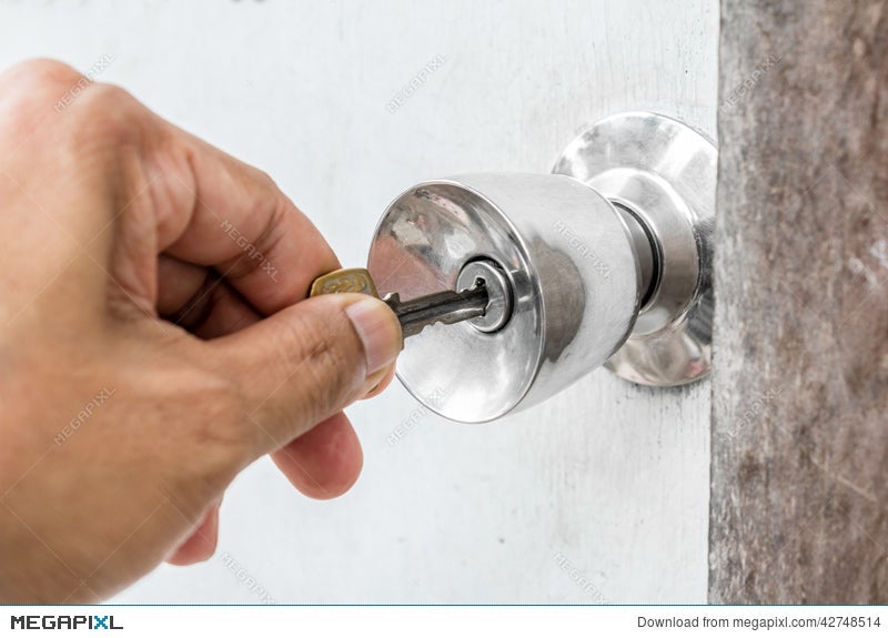 Unlocking Door With Key In Hand Stock Photo 42748514 Megapixl