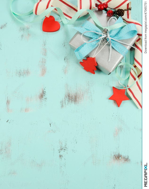 Download Modern Red And White Christmas Decorations On Aqua Blue Wood Background With Silver Gift Vertical Stock Photo 47065751 Megapixl PSD Mockup Templates