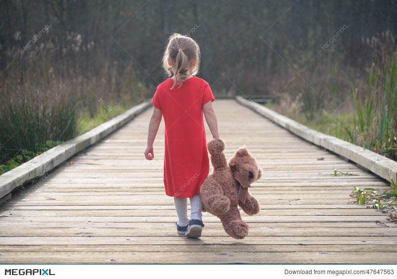 girl holding a teddy bear