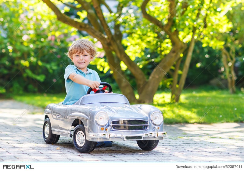 little boy car driving