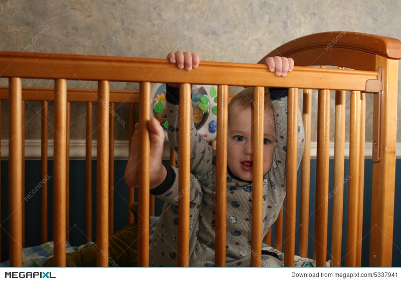 Toddler Climbing Out Of Crib Stock Photo 5337941 Megapixl