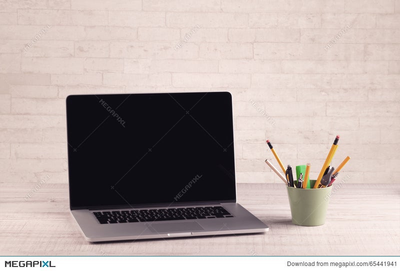 Office Desk Closeup With White Brick Wall Stock Photo 65441941