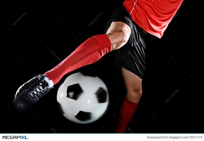 Close Up Legs And Soccer Shoe Of Football Player In Action Kicking Ball Isolated On Black Background Stock Photo Megapixl