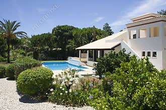 Beautiful villa with a healthy garden and a pool