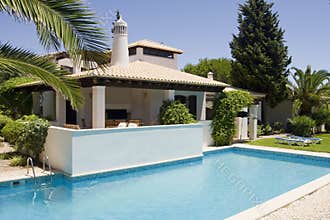 Beautiful villa with a healthy garden and a pool