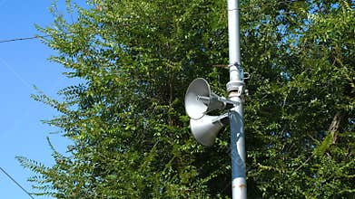 Loudspeakers fitted to make announcements on the street pole.