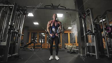 Male bodybuilder training chest muscles in slow motion