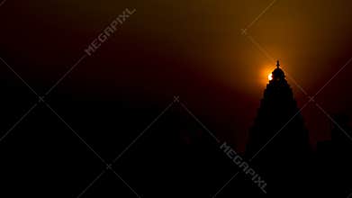 Sunrise : Halo behind the Top of a Hindu temple.