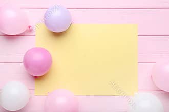 Balloons with sheet of blank paper