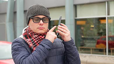 Blind Man With Blindness Using Digital Assistant On Smartphone