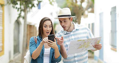 Excited tourists finding best online offer on vacation