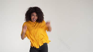 Cheerful african american woman dancing