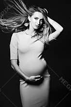 Black and white portrait of beautiful pregnant woman.