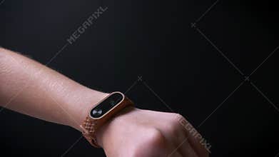 Close-up hand of girl on black background, sport modern concept, indoor activity