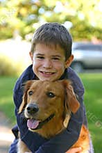 Boy Hugging Dog