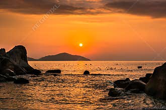 Nature Seascape with Boulders, Islands and Waves at Orange Sunrise