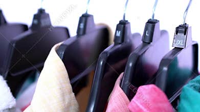 Fashion clothes on clothing rack ,colorful closet