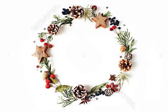 Christmas circle floral composition. Wreath of cypress, eucalyptus branches, pine cones, rowan berries, anise, confetti