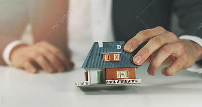 Salesman offering new house to buy