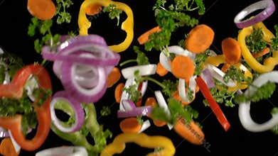 Falling slices of chopped vegetables, slow motion