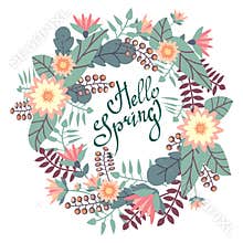 Greeting card with floral wreath and Hello Spring brash pen lettering.