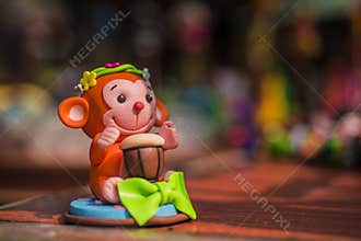Clay-shaped orange-red monkey, toys, crafts, close-up