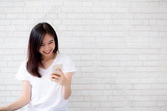 Beautiful of portrait young asian woman touch phone and smile st