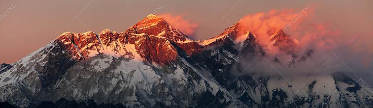 Evening sunset red colored view of mount Everest Lhotse and Nuptse south rock face with beautiful clouds from Kongde village,