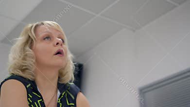 Woman working out on static bike.