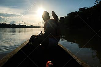 A man navigates the Javari River on a boat