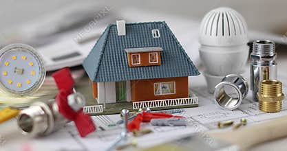 House construction project - tools and equipment with scale model