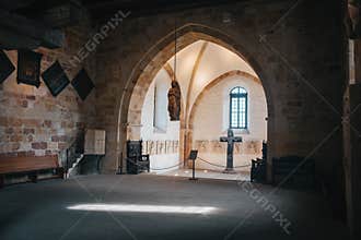 Catholic church interior with medieval walls and arch designed construction