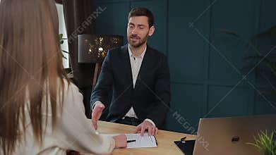 Woman sign mortgage contract, put signature on sale purchase rental agreement, handshaking realtor at meeting with