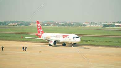 Air Asia Airlines Parked in Wattay International Airport in the Gateway Ready for Served Passengers.