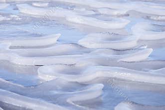 Closeup of amazing abstract natural ice sculptures on frozen Usma lake in Latvia.