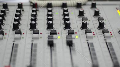 Radio station. Professional multitrack mixing console, computer and microphone in the control room. Recording and broadcasting pro