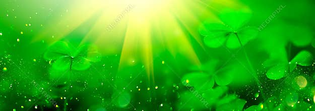 St. Patrick`s Day green blurred background with shamrock leaves. Patrick Day. Abstract border art design