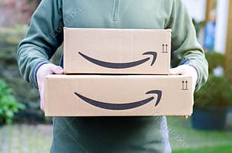 Soest, Germany - January 14, 2019:  Man delivers Amazon Prime package