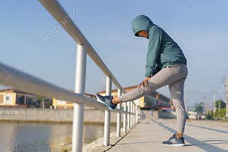 Asian women who are warming their bodies  prepare to run