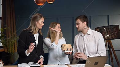 Team of three architect working in the office.